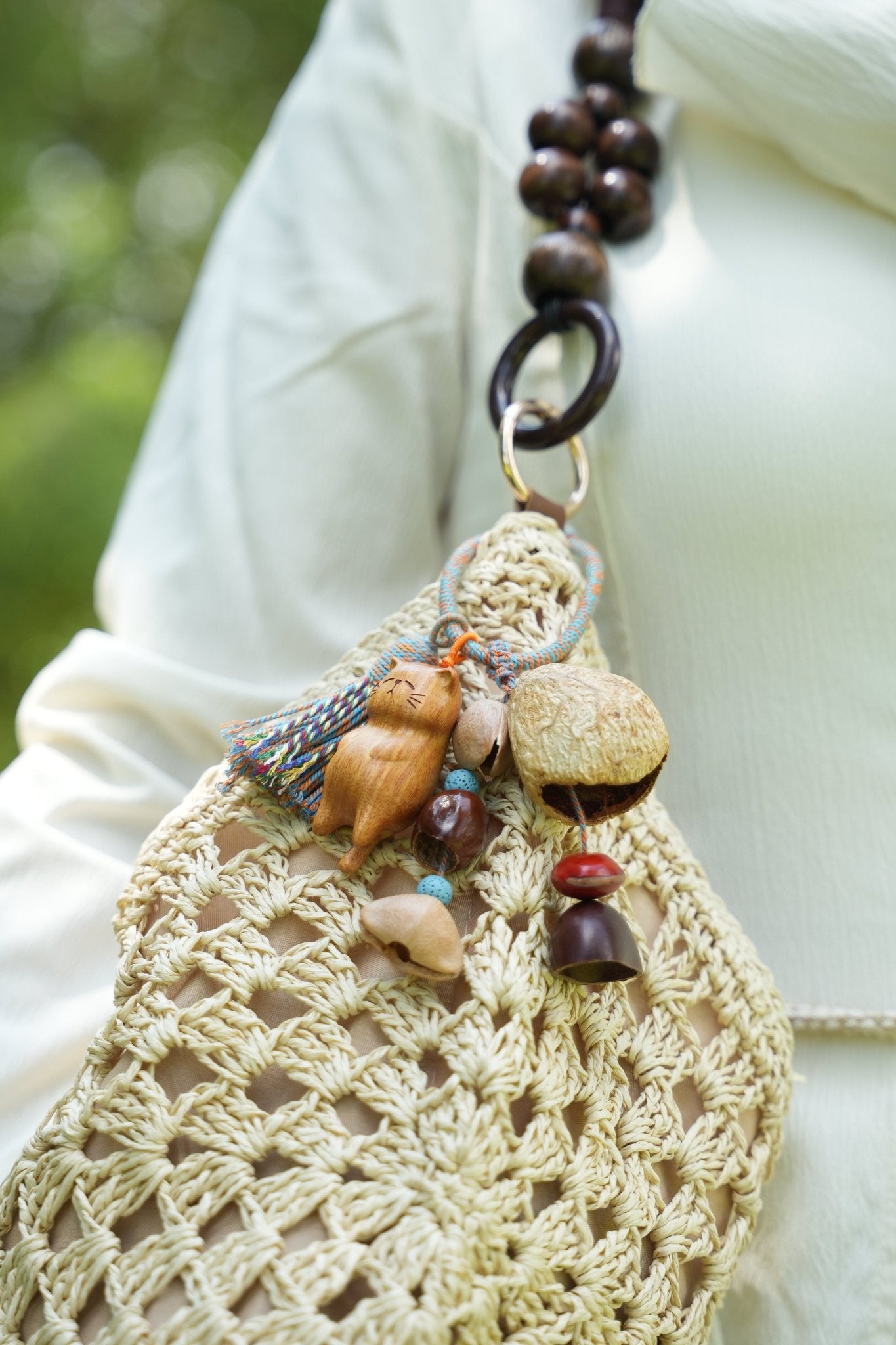 "The Naptime Kitty" - Hand-Carved Wooden Cat Charm with Natural Seeds & Tassel